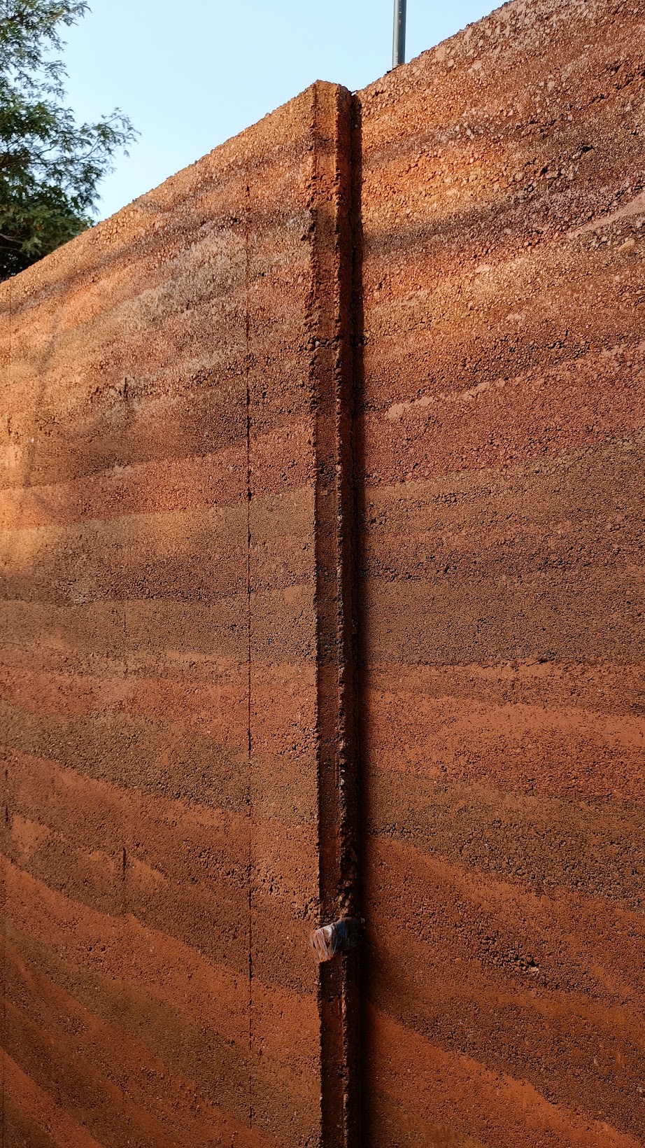 Layered rammed earth wall texture
